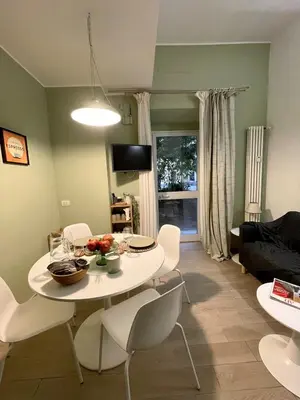a living room with a white table and chairs at Mazzini ApartmenT, next to Vatican City in Rome