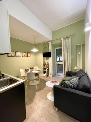 a living room with a couch and a table at Mazzini ApartmenT, next to Vatican City in Rome
