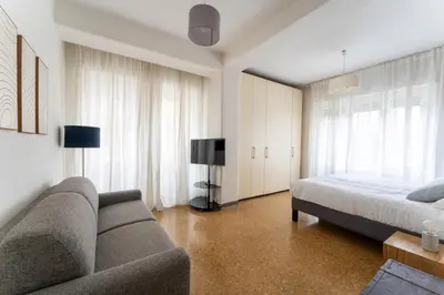 a living room with a couch and a bed at MP House in Trastevere in Rome