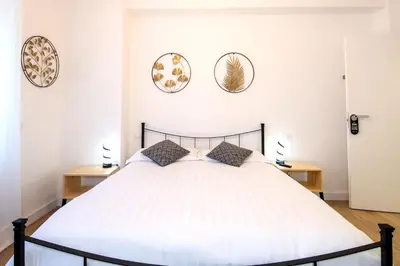 a bedroom with a bed and three plates on the wall at Una stanza alPigneto in Rome