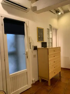 a room with a dresser and a window and a dresser at Ideal for your Roman Holidays in Rome