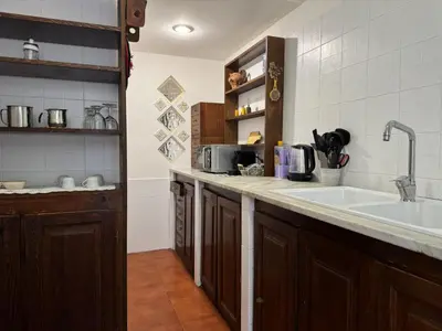 a kitchen with a sink and a counter top at Gianicolense sweet Home in Rome