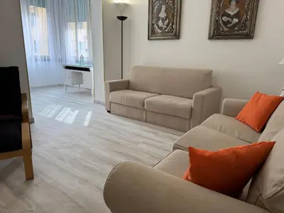 a living room with a couch and a chair at Gianicolense sweet Home in Rome