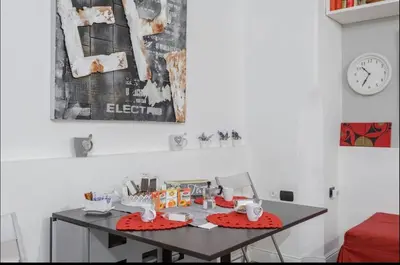 a table with toys on it in a room with a clock at Rome Studio Centro Storico in Rome