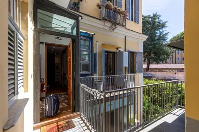 a house with a balcony and a door at La Grande Casa - City Center in Rome