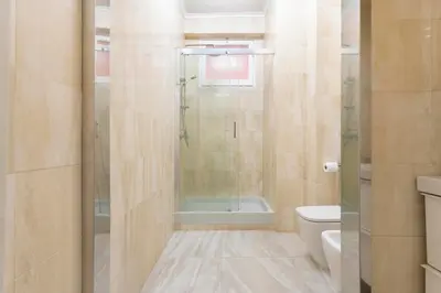 a bathroom with a shower and a toilet at SAN GIACOMO 22 Luxury House in Rome