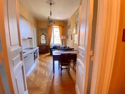 a kitchen with a table and a dining room at My Varrone Suite in Rome
