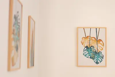 a row of framed pictures hanging on a wall at Luxury & Design Apartment Piramide in Rome