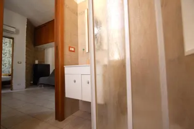 a kitchen with a sliding glass door in a room at San Giovanni Holiday Home in Rome