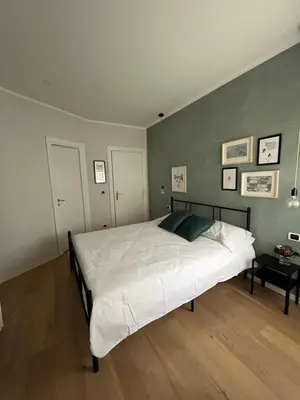 a bedroom with a large white bed in a room at Urban Corner in Rome