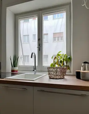 a kitchen counter with a sink and a window at Urban Corner in Rome