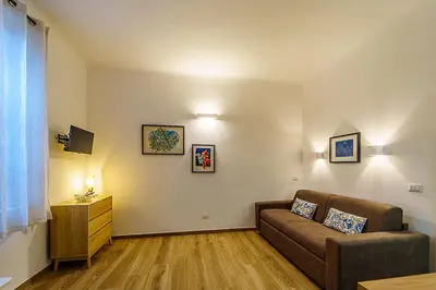 a living room with a couch and a television at Casa Cesari in Rome