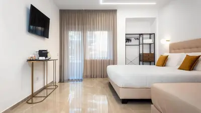 a hotel room with a bed and a couch at Aura Vatican Suite in Rome