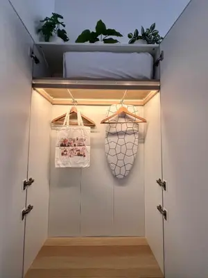 a room with a closet with a bed and lights at Trastevere ON in Rome