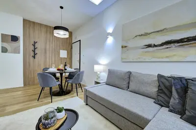 a living room with a couch and a table at Silver Loft San Giovanni in Rome