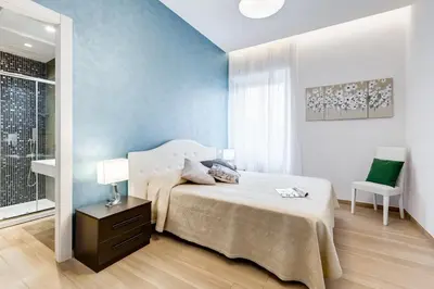 a bedroom with a bed and a table and a chair at Vatican Brothers in Rome