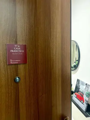 a wooden door with a sign on it at CASA FRANCISCA - New Boutique Apartment in Rome