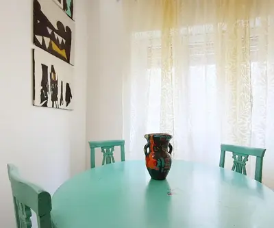a vase sitting on a table in a dining room at A Casa di Adriana in Rome