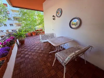 a balcony with a table and chairs on a patio at Luxury Home Museum - Roma - RAI - Stadio Olimpico - Vaticano - Musei Vaticani - Centro - Clodio in Rome