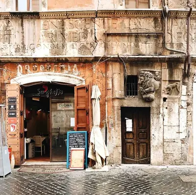 a building with a sign in front of it at Caesar's Nest in Rome