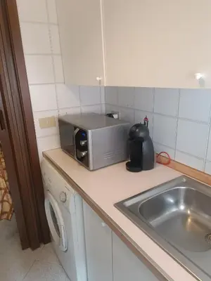 a kitchen counter with a toaster and a sink at Teresa Amor INN Roma in Rome