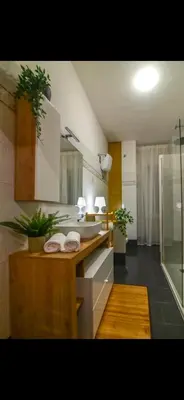 a kitchen with a counter with two towels on it at Mamma ROMA ART in Rome