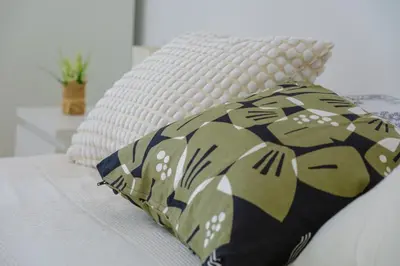 a pillow sitting on top of a bed at Rome Urban Retreat - Metro A in Rome