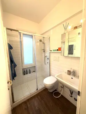 a bathroom with a shower and a toilet and a sink at Happy House with private garden in Rome