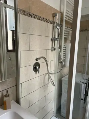 a bathroom with a shower and a sink at Saint Peter & Giulio Cesare in Rome