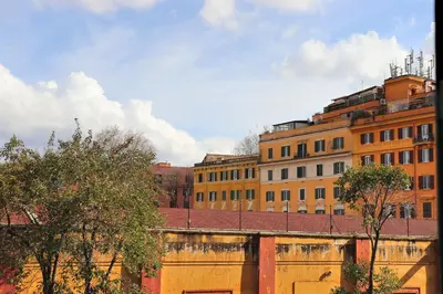 a group of buildings with trees in front of them at Saint Bon Dream in Rome