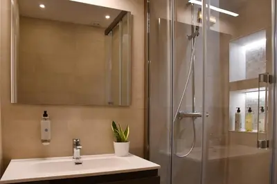 a bathroom with a sink and a shower at Maralf Urban Suites in Rome