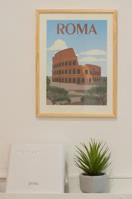 a picture of roma on a wall above a computer at Giano Vatican Suites - Metro Cipro in Rome