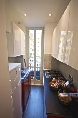 a kitchen with a sink and a stove top oven at Piramide House in Rome