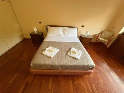 a bedroom with a bed with two towels on it at Apartment in Trastevere 41 in Rome
