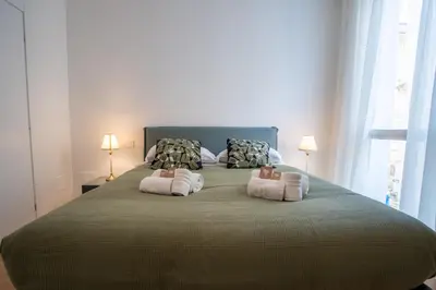 a bedroom with a large bed with two pillows at Luxury Sweet Home Labicana in Rome