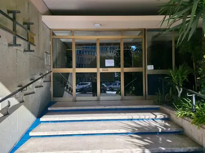 an entrance to a building with glass doors at La Dimora dell'Antiquario in Rome