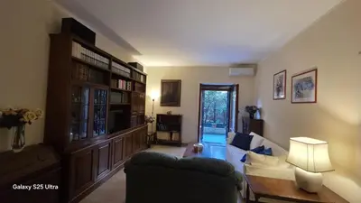 a living room with a couch and a table at Casa Orietta in Rome