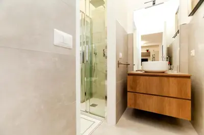 a bathroom with a sink and a shower at Dimora Cavallini in Rome