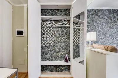 a room with a wall covered in wallpaper at La Casina your suite in Monti in Rome