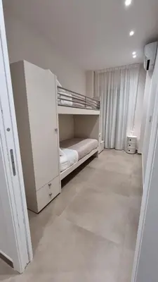 a white room with a bunk bed in it at T&T Luxury Home Rome Int 5 in Rome