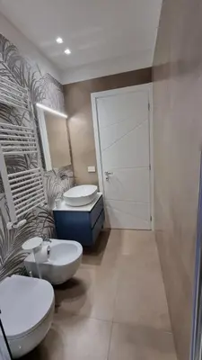 a bathroom with two sinks and a toilet in it at T&T Luxury Home Rome Int 5 in Rome