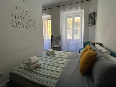 a bedroom with a large bed with towels on it at Lilla a Testaccio in Rome