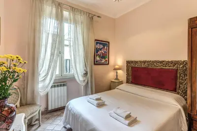 a bedroom with a bed with two towels on it at Casa Vacanze San Giovanni in Rome