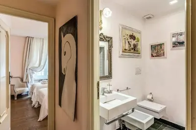a bathroom with two sinks and a mirror at Casa Vacanze Crispi little 1 in Rome