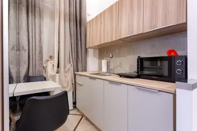 a kitchen with a sink and a microwave on a counter at Oliviero - Piazza Navona Suite in Rome