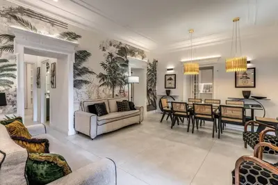 a living room with a couch and a dining room at Luxury flat with terrace by historic center in Rome