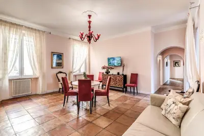 a living room with a table and chairs at Casa Vacanze Collina in Rome