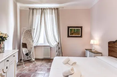 a bedroom with a large bed and a window at Casa Vacanze Collina in Rome