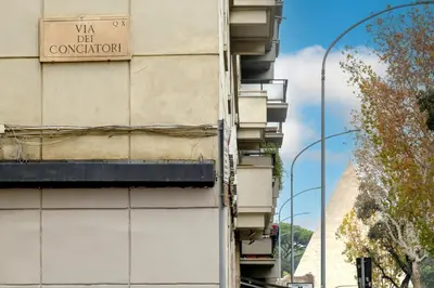 a building with a sign on the side of it at Domus Maria in Rome