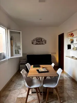 a living room with a table and a couch at Trastevere Ripa Apartments in Rome